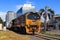 A DL-class diesel-electric locomotive rolling through Tauranga, New Zealand