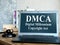 DMCA Digital Millennium Copyright Act on laptop and gavel.