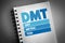DMT - Dry Metric Ton acronym on notepad, business concept background