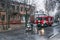 Dnepr, Ukraine - December 14, 2017: Two firemen from the rescue service connect the water hoses to extinguish the fire. Water jets