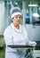 Dnepropetrovsk, Ukraine - 03.10.2016: Sweets factory. Sweets production process. A woman technologist monitors the work of an