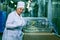 Dnepropetrovsk, Ukraine - 03.10.2016: Sweets factory. Sweets production process. A woman technologist monitors the work of an