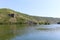 Dniester river tributary, Ukraine. The green banks of a large river with calm water.