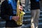 Dnipro city, Ukraine. Wind orchestra musicians in black Ukrainian embroidered shirts play saxophones at a festival