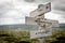 do amazing things text engraved on old wooden signpost outdoors in nature