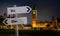 Do or die roadsign in front of UK Houses of Parliament at midnight. Composite image. Brexit danger or deadline warning