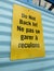 Do Not Back In yellow sing on blue garage door