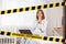 Do not cross.Barrier tape - quarantine, isolation.A pregnant woman is sitting on the bed with a laptop on her lap, with a shocked