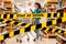 Do not cross.Barrier tape-quarantine,isolation.A young Caucasian woman rolls a grocery cart around the store and uses a mobile