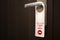 Do not disturb sign on closed door handle