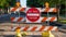 Do not enter, road works. Road sign, text do not enter and barriers, urban background