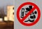 Do not litter sign with the ban icon in front of the symbols of banana peel, paper, plastic bottles, cans, plastic cups and apple