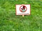 DO NOT WALK ON LAWNS. Please keep off the grass sign.