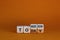 Do it today not tomorrow. Turned wooden cubes and changed the word `tomorrow` to `today`. Beautiful orange background, copy sp