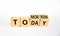 Do it today not tomorrow. Turned wooden cubes and changed the word `tomorrow` to `today`. Beautiful white background, copy spa