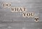 Do what you love sign heart symbol on wood board