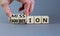 Do your mission with ambition. Businessman turns wooden cubes and changes the word `mission` to `ambition`. Beautiful grey tab