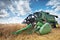 Dobrich, Bulgaria - July 08: Modern John Deere combine harvesting grain in the field near the town Dobrich, Bulgaria July 08, 2016