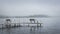 Dock with benches on foggy lake in Bemidji Minnesota