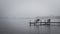 Dock with benches on foggy lake in Bemidji Minnesota