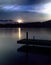 Dock on lake at sunset
