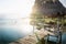 Dock during sunset with sun rays at lake Itza, El Remate, Peten, Guatemala