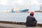 Dock worker finishing work sitting at the port