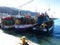 Docked fishing boats alongside the quay at Kalk Bay harbour near Cape Town.