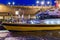 Docked modern lighted boat, in the port of Vlissingen at night, Zeeland, The Netherlands