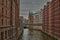 Docks in Hamburg, Germany. Speicherstadt in Hamburg, Germany. Channel and brick buildings in Hamburg