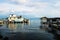 Docks with house and boats in the ocean during sunset in Utila, Honduras, Central America