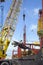 Dockside Crane Unloading Steel Rods From Freighter