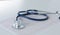Docter workplace with a stethoscope Cardiogram chart with medical table closeup,for heart record