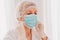 doctor adjust the face mask to protect herself against covid-19 virus