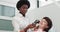 The doctor is African American dermatologist examines a skin. Professional doctor the dermatologist research a birthmark