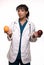 Doctor with apple and orange