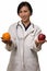 Doctor with apple and orange