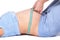 Doctor arms measuring length of lying abdomen pregnant woman