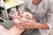 Doctor beautician makes cosmetic facial massage. Woman relaxes on a cosmetic chair