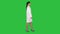 Doctor beautician in a white robe is walking on a Green Screen, Chroma Key.