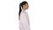 Doctor beautician in a white robe is walking on white background.