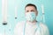 Doctor in blue face mask catches flying syringes. Thinking about vaccine for covid-19 coronavirus, flu, infectious diseases.Mass