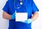 Doctor in blue uniform and sterile latex gloves holding open blank notebook