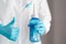 Doctor with blue water pulse nasal wash bottle