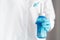 Doctor with blue water pulse nasal wash bottle