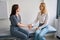 Doctor checking heart rate of mature woman during physical examination