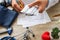 Doctor during consultation held in his hand and show to patient medication in capsules in blister pack. Concept photo of scene of