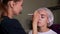 Doctor cosmetologist does procedure permanent makeup female client lips 4K