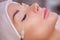 The doctor cosmetologist makes the Botulinotoxin injection procedure for tightening and smoothing wrinkles on the face