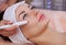 The doctor-cosmetologist makes the procedure treatment of Couperose of the facial skin